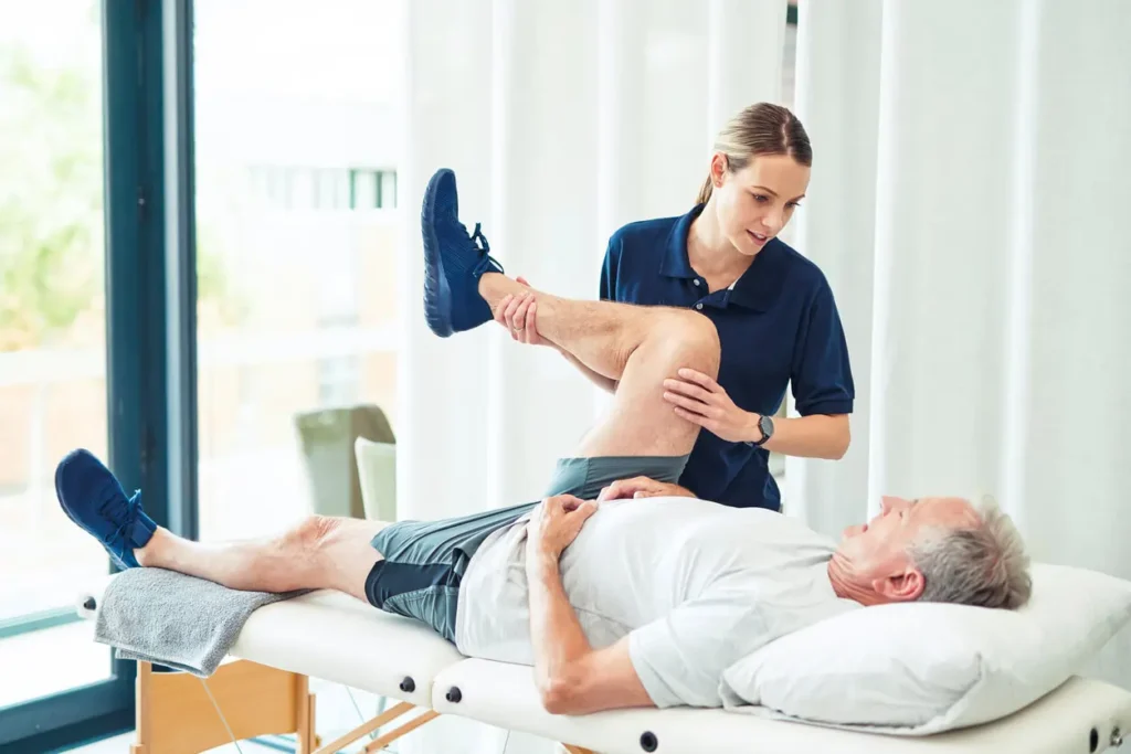 Revitalising Recovery: Effective Rehabilitation Strategies for Muscle Injuries 3 Physiotherapist assisting a patient with muscle recovery exercises Market Harborough